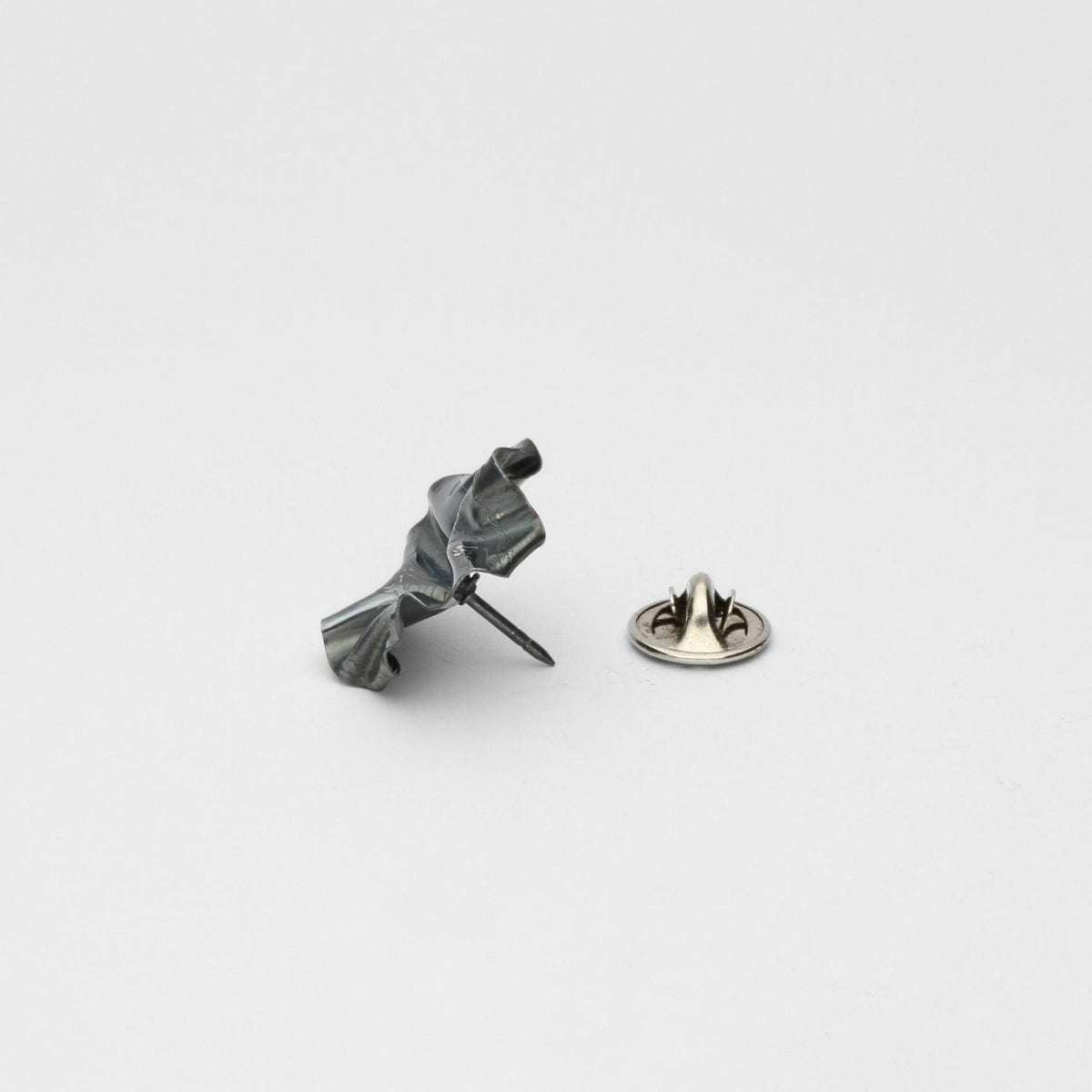 Decorative Concepts lapel pin in black oxidised silver, side view