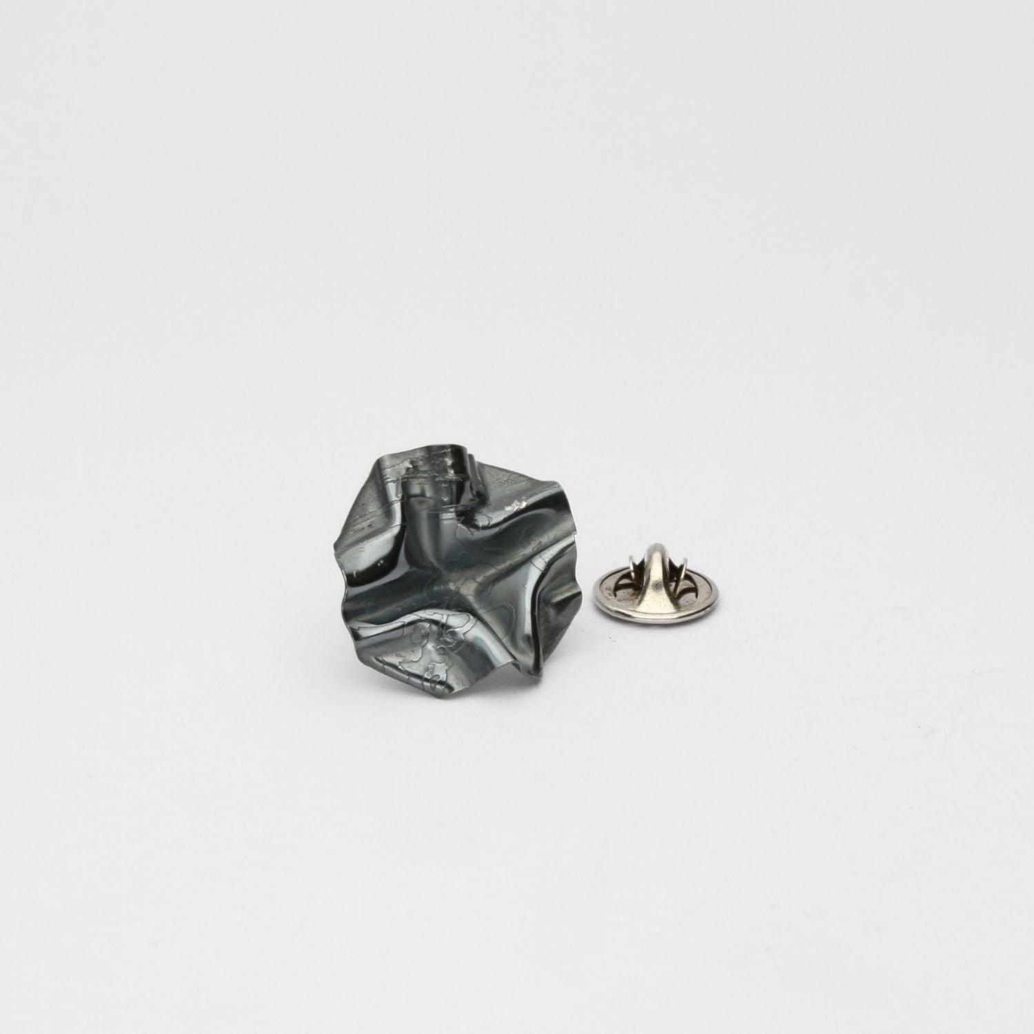 Decorative Concepts lapel pin in black oxidised silver, front view