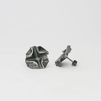 Close-up on the writing etched into a Decorative Concepts large stud — Clustdlysau Arian