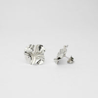 Decorative Concepts large sterling silver stud earrings, side view