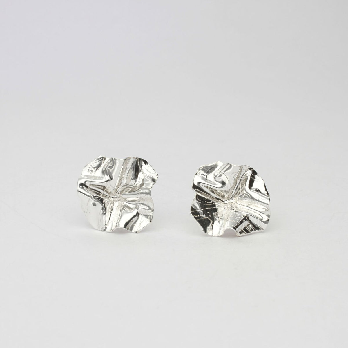 Decorative Concepts large sterling silver stud earrings, front view