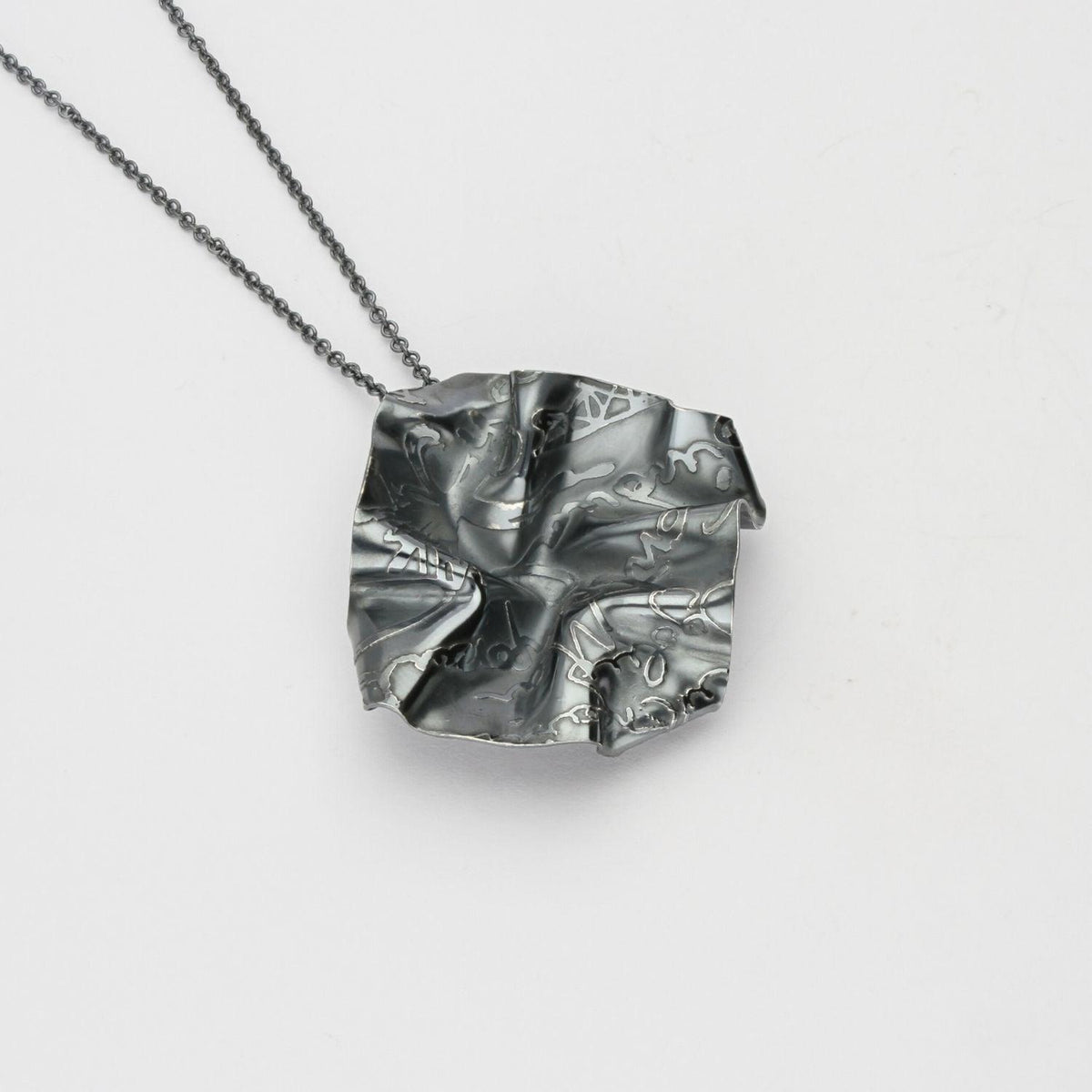 Decorative Concepts medium pendant, black oxidised silver — a mark drawn from a sketchbook page — Mwclis Arian