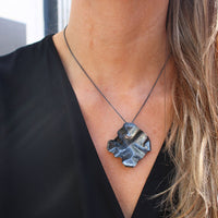 Decorative Concepts medium pendant in black oxidised silver, shown on model
