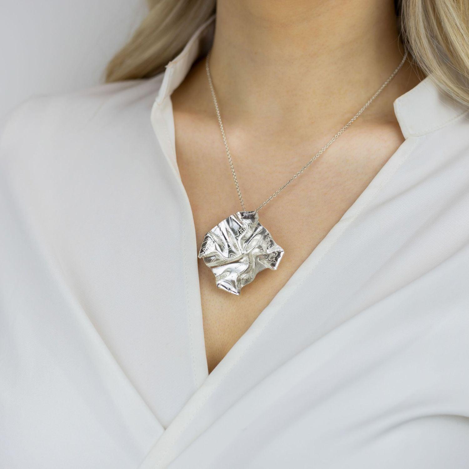 Decorative Concepts medium sterling silver pendant, side view