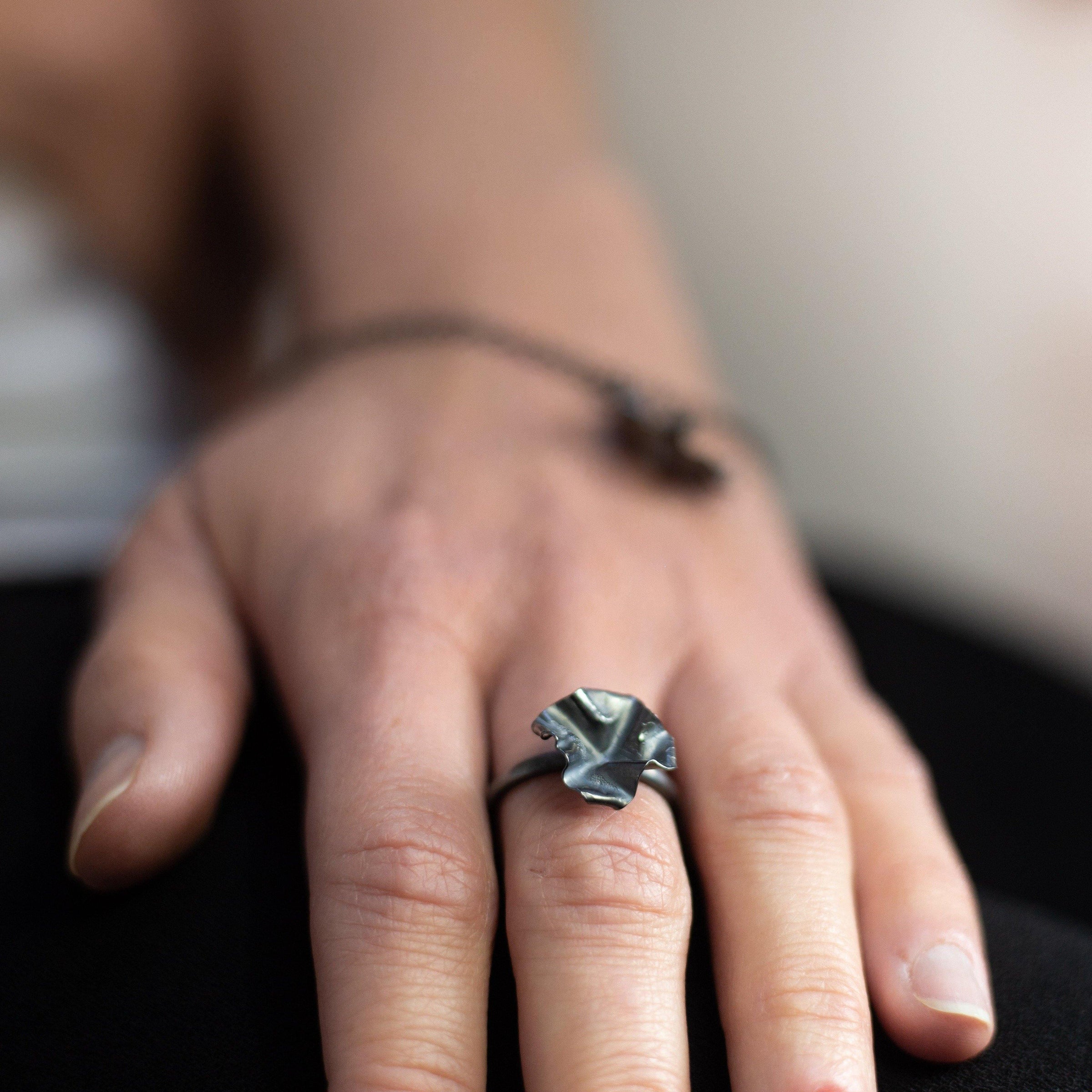 Side view of the Decorative Concepts black ring, drawn from a sketchbook page — Modrwy Arian