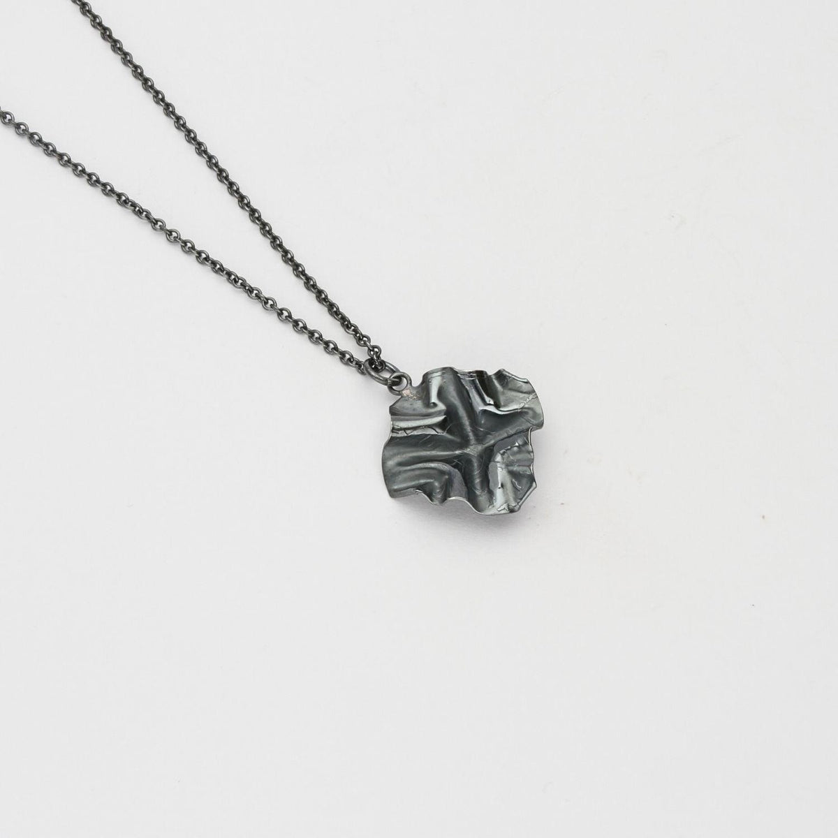 Decorative Concepts small pendant, black oxidised silver — covered in Mari's own handwriting — Mwclis Arian
