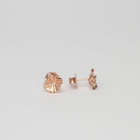 Side view of the Decorative Concepts rose gold studs, tracing a sketched line — Clustdlysau Arian ac Aur