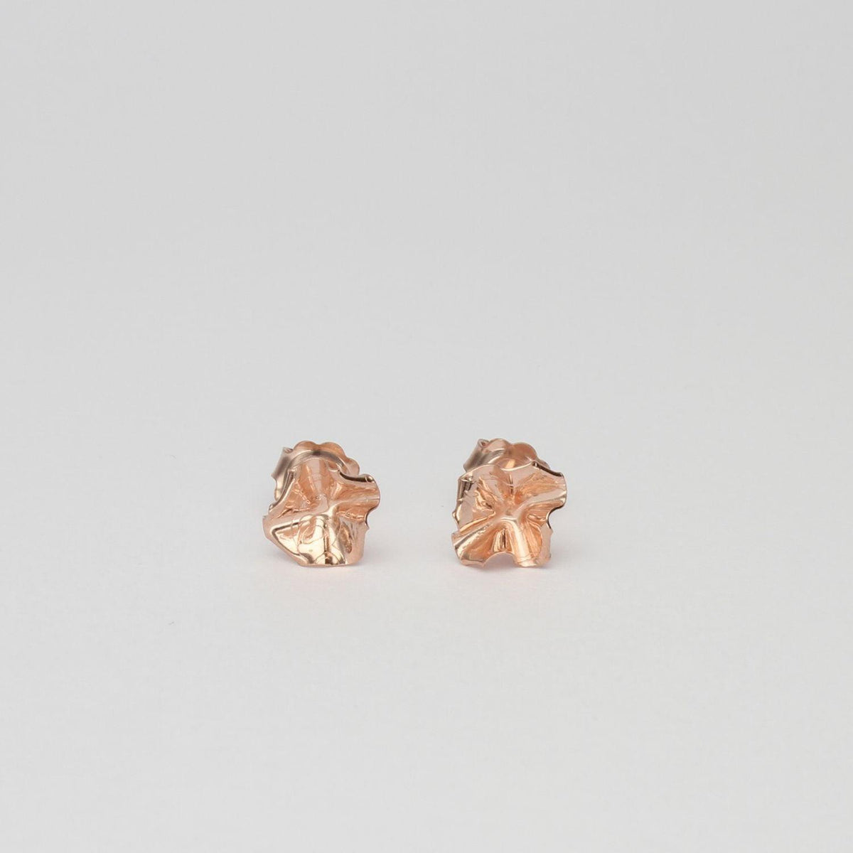 Decorative Concepts small stud earrings in 18ct rose gold plated silver, front view