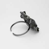 Decorative Concepts torque bangle in black oxidised silver, side view