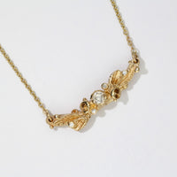 Sea thrift 9ct yellow gold pendant with diamonds by Charlotte Rowenna