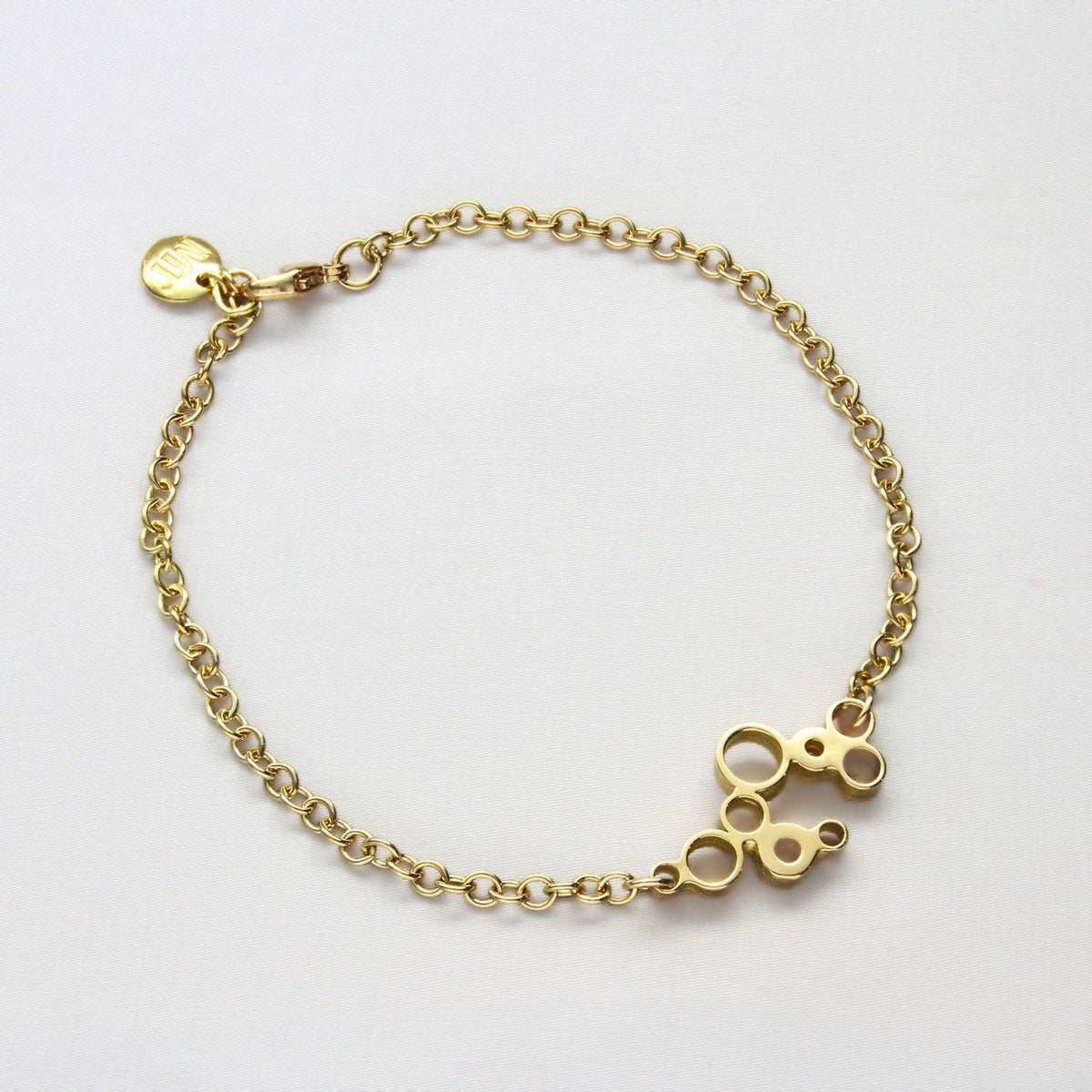 Golden Bubbles bracelet, 18ct gold — clustered circles inspired by rising champagne bubbles — Breichled Aur