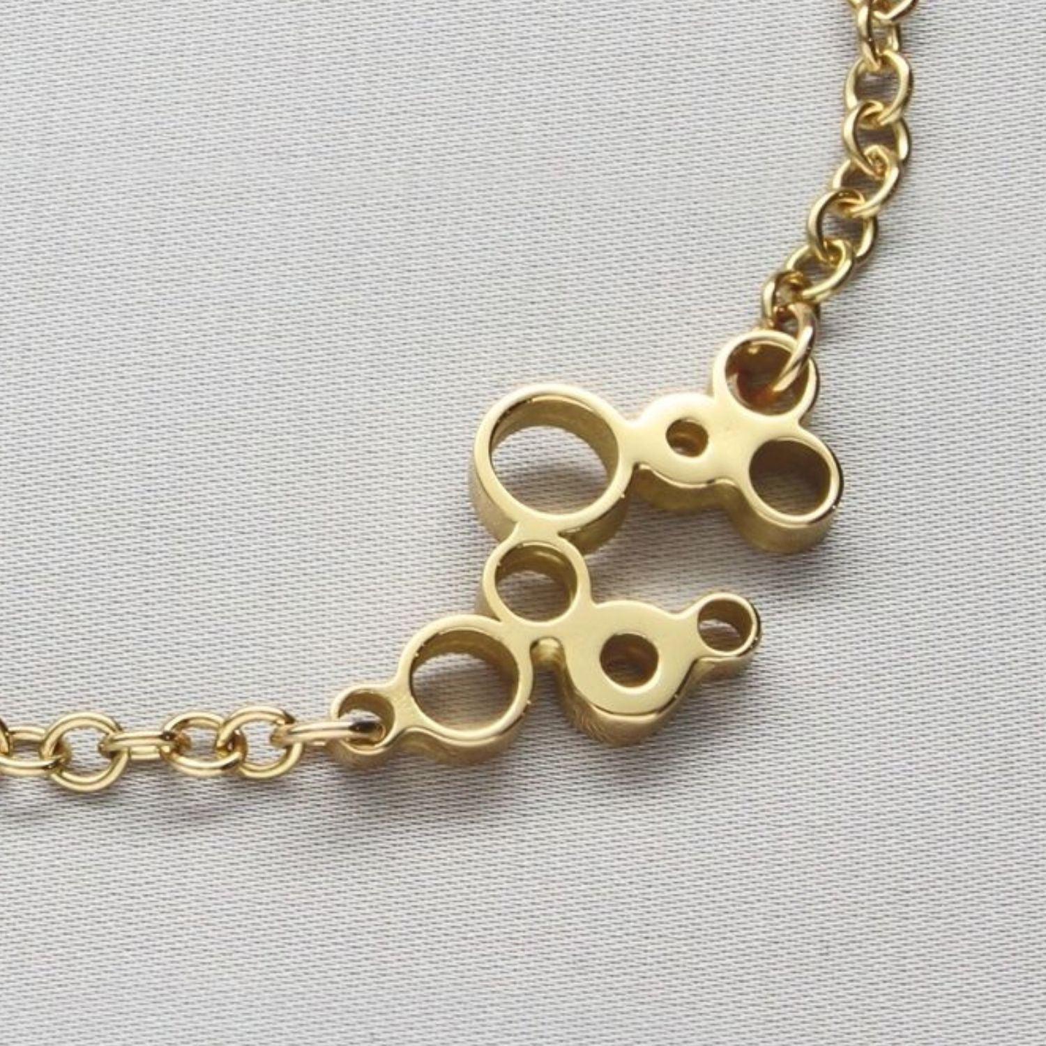 Golden Bubbles bracelet, celebration-themed design, side view — Breichled Aur