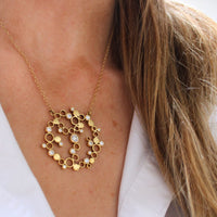 Model wearing the one of a kind Golden Bubbles diamond pendant — Mwclis Aur