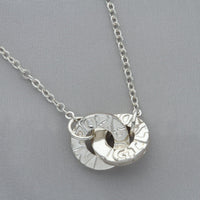 Gyda'n Gilydd sterling silver linked pendant, close-up detail