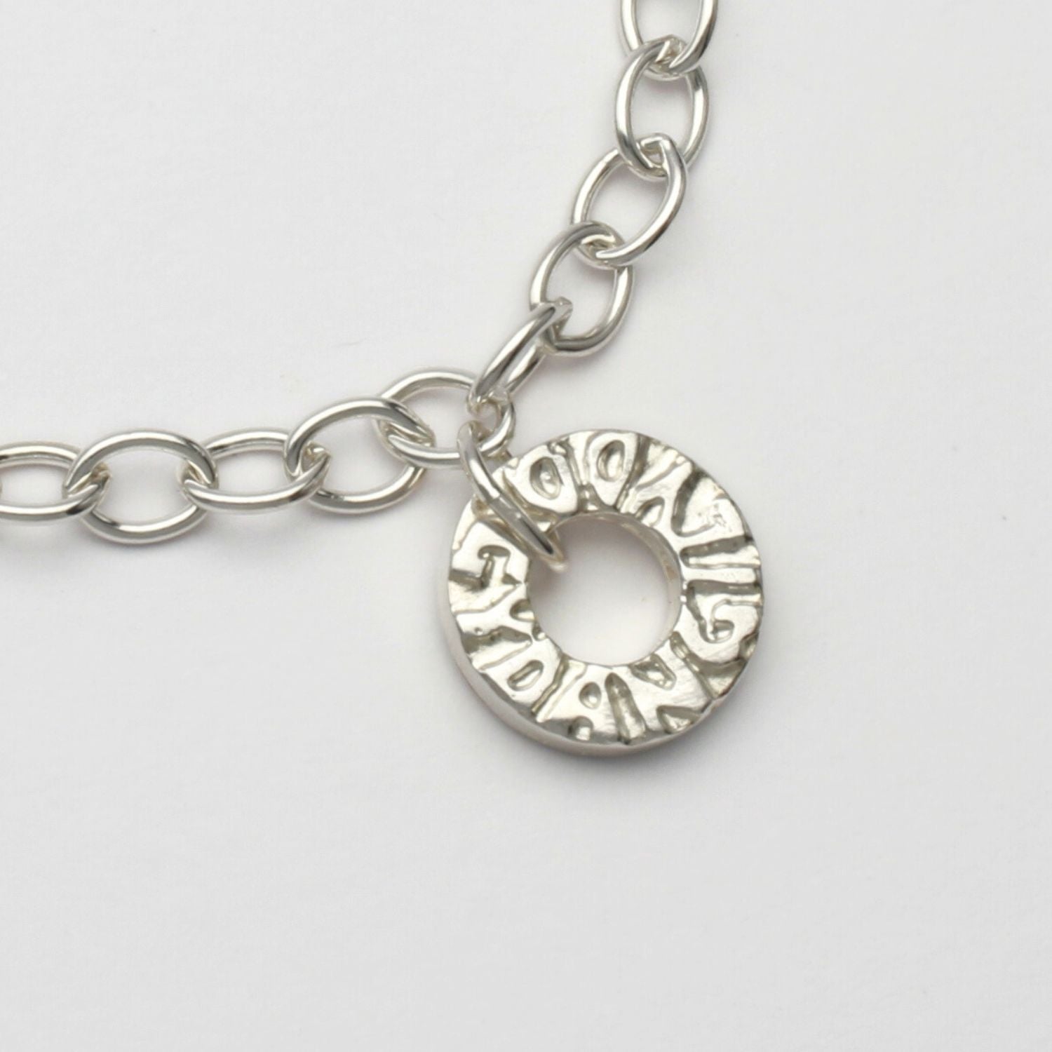Gyda'n Gilydd bracelet close-up of handwritten charm engraving, sterling silver