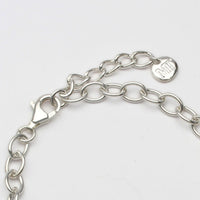 Close-up on the clasp of the Gyda'n Gilydd single charm bracelet — Breichled Arian
