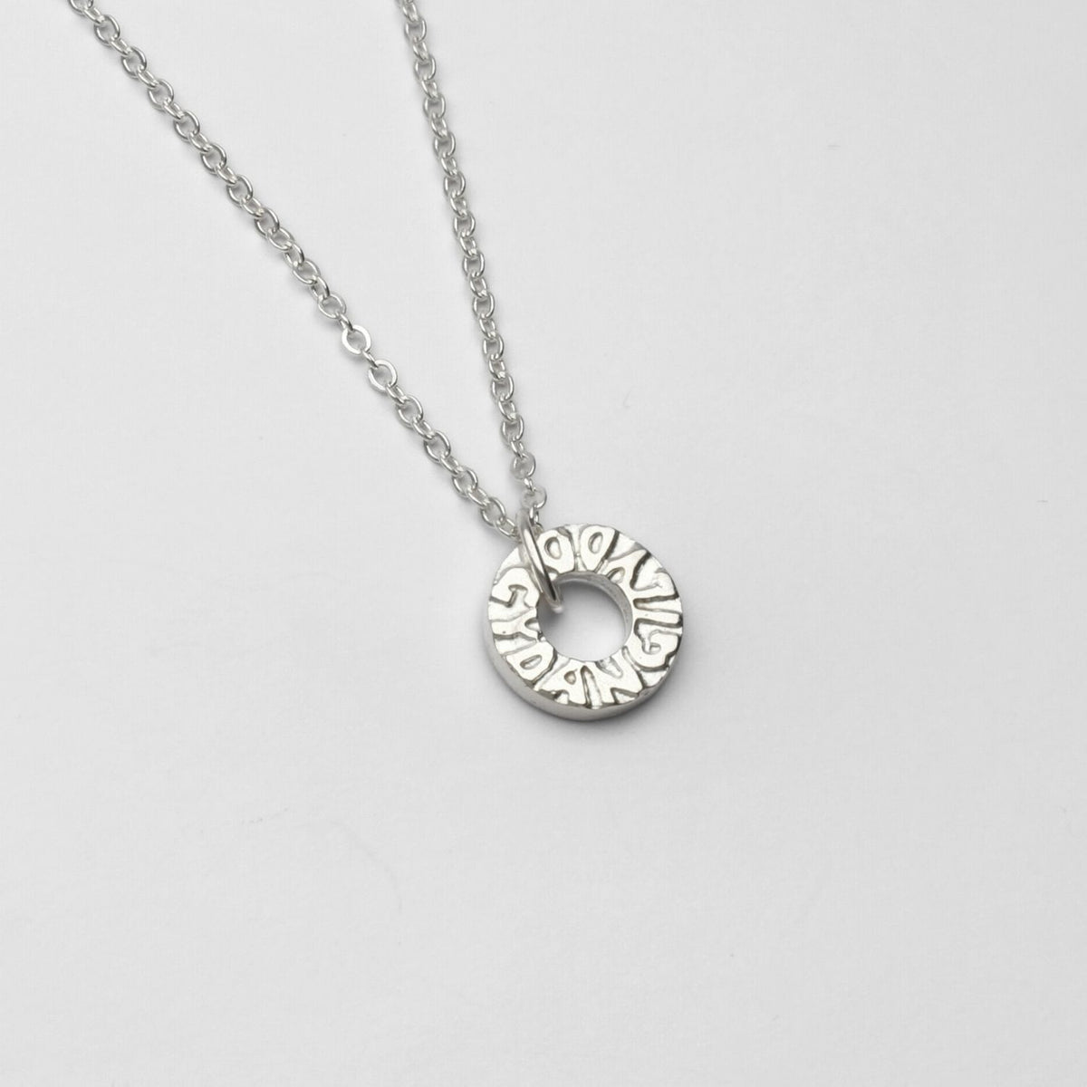 Gyda'n Gilydd single charm pendant, sterling silver — "together" written in Mari's own hand — Mwclis Arian