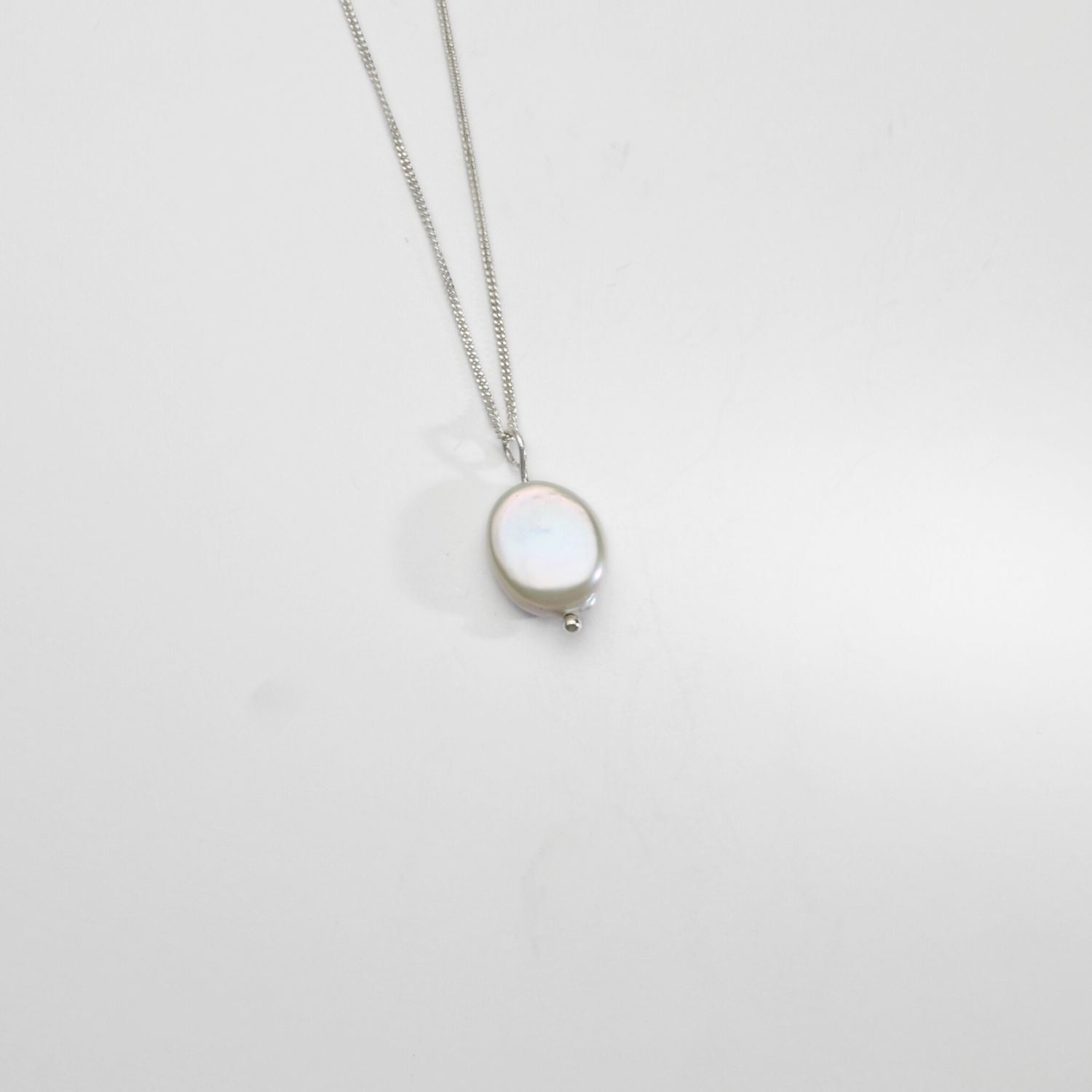 Silver coin fresh water pearl pendant