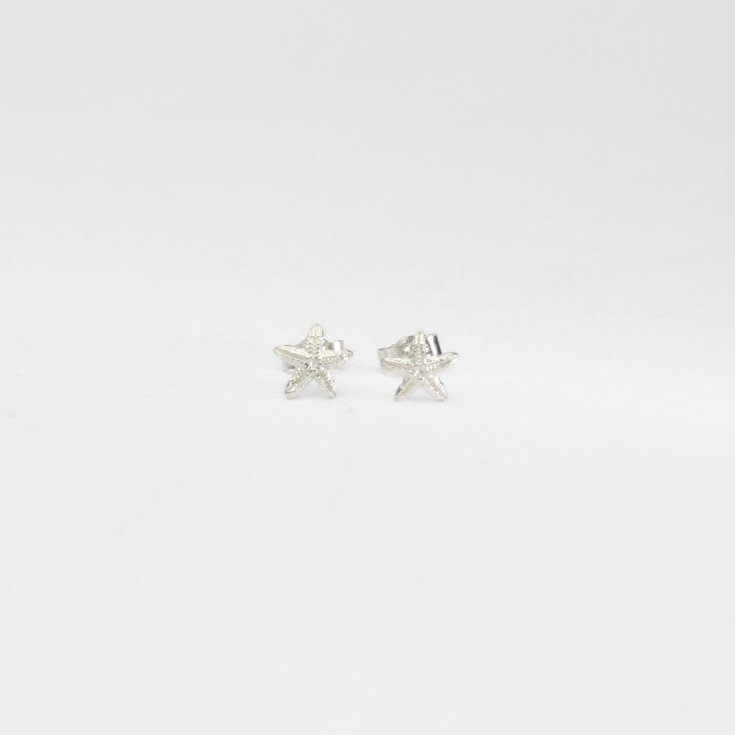 Small starfish silver studs by Kate Wimbush