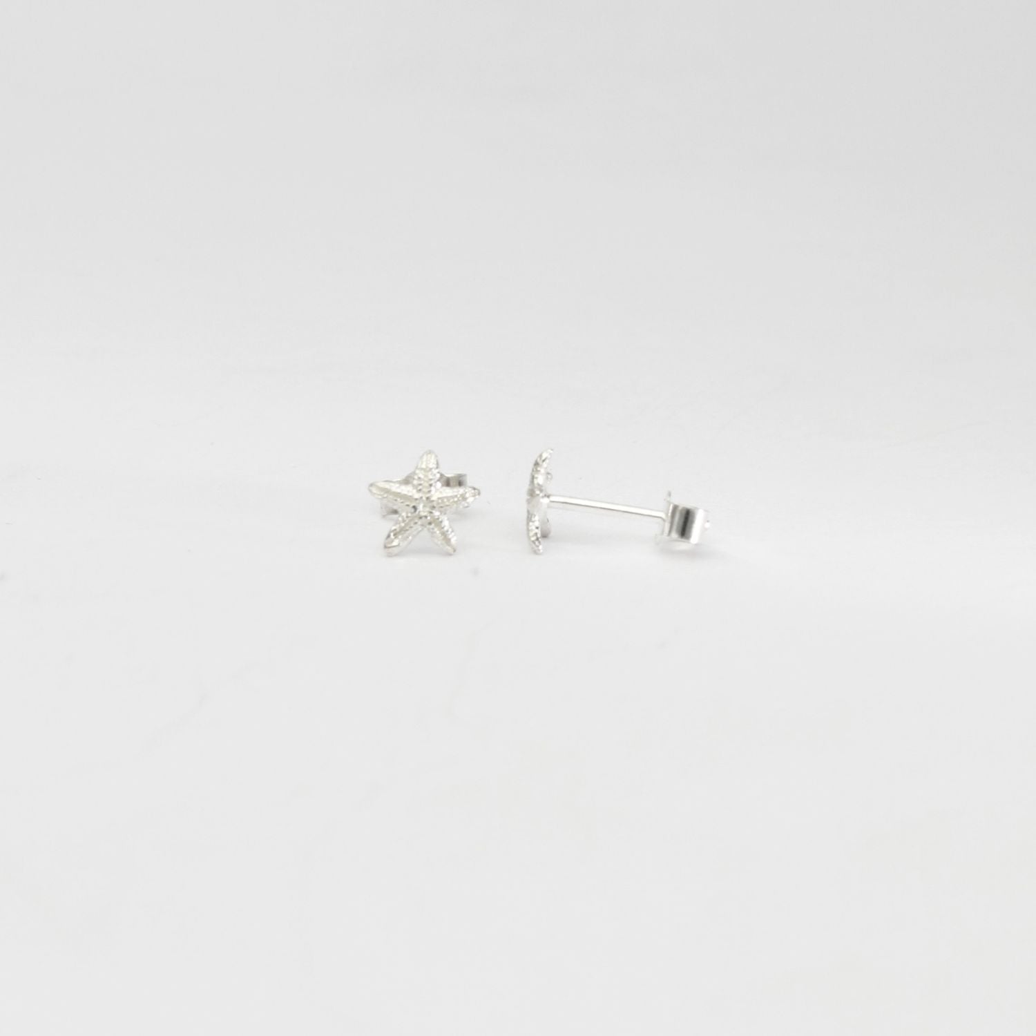Small starfish silver studs by Kate Wimbush