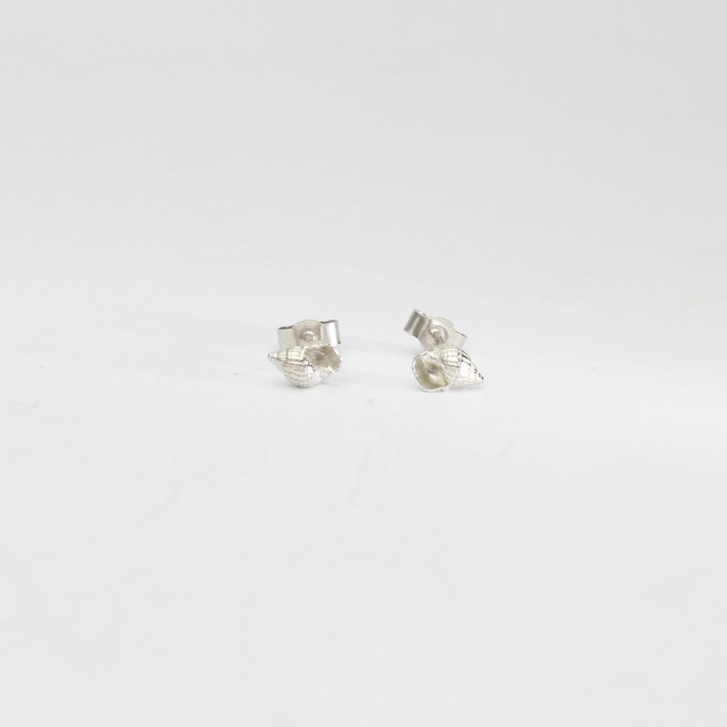Small whelk silver studs by Kate Wimbush
