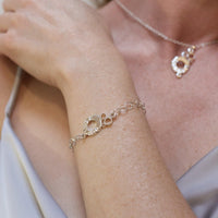 Sterling silver charm bracelet with engraved Welsh word charm, close-up detail