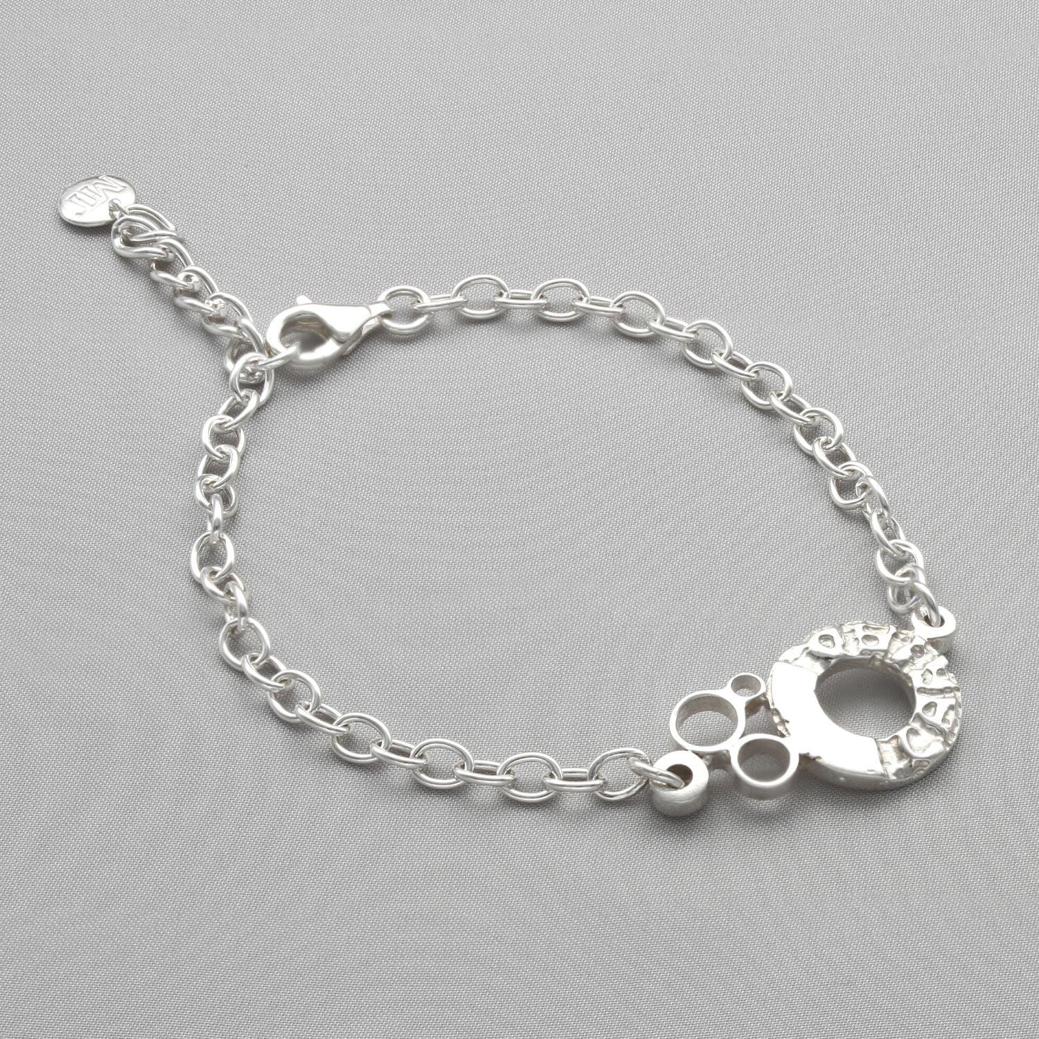 Sterling silver charm bracelet with engraved Welsh word charm, front view